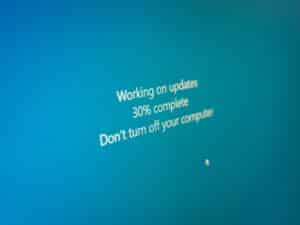 dangers of out of date software and snoozing updates; blue screen displaying "working on updates 30% complete don't turn off your computer"