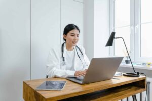 Doctor using a computer in her office